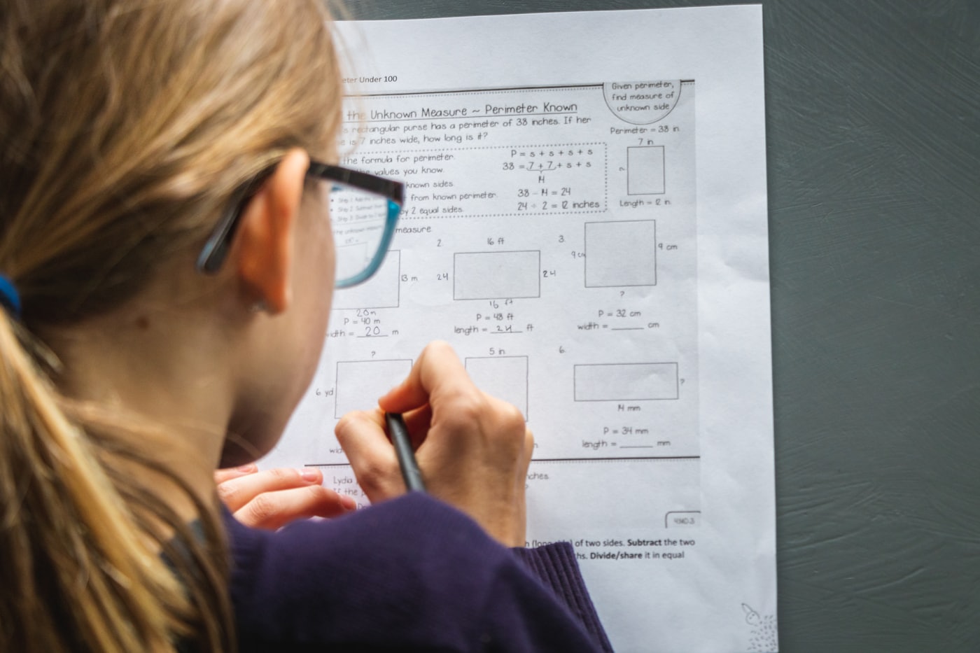 A student working against the clock at a study desk